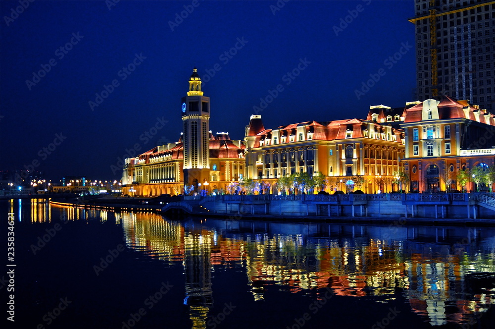 city buildings at night with reflection 