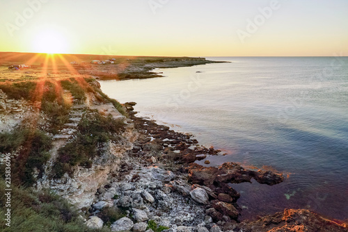 Early morning, sunrise. Camping on the shore of the black sea in the area of Tarkhankut.Crimea