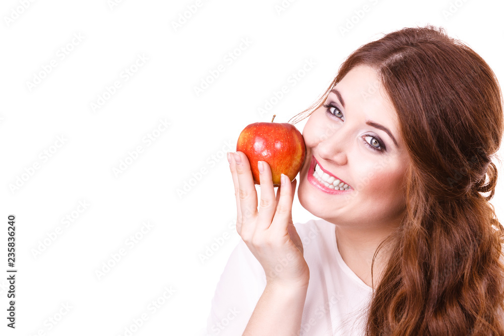 Woman holds apple fruit close to face, isolated Woman holds apple fruit close to face, isolated