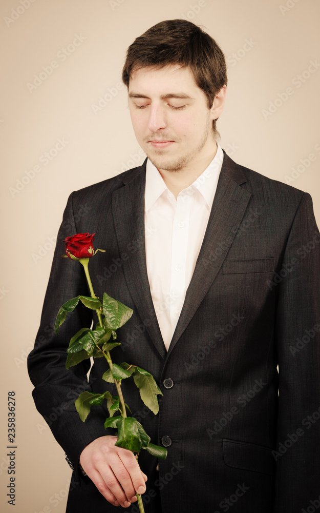 Elegant young man with red rose. Elegant young man with red rose.