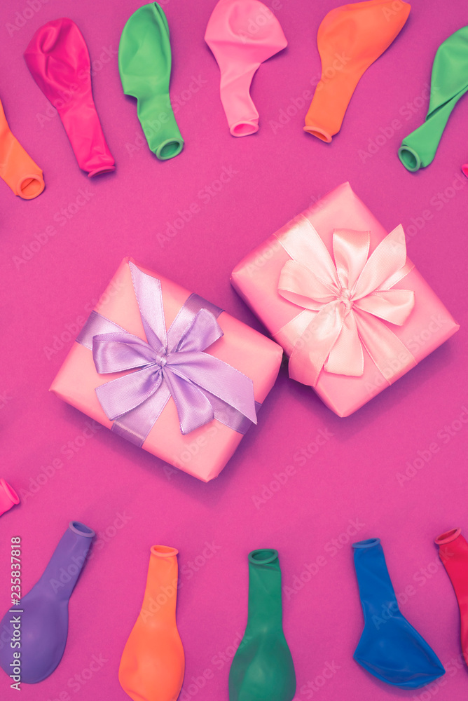 Set of colored balloons on pink background Flat lay top view Set of colored balloons on pink background Flat lay top view