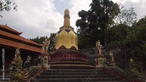 Buddhist temple Brahma Vihara Arama with statues of the gods on Bali island, Indonesia. Balinese Temple, old hindu architecture, Bali Architecture, Ancient design. Travel concept. photo