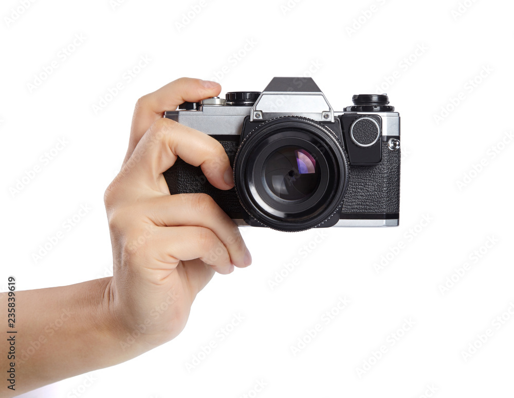 Hands holding a camera, cut out. Taking picture.