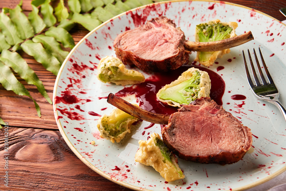 Roasted lamb ribs with berry sauce and broccoli Roasted lamb ribs with berry sauce and broccoli