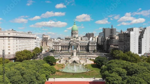 Aerial drone view of Buenos Aires national congress parliament building with dome roof, fountain plaza park and statute photo