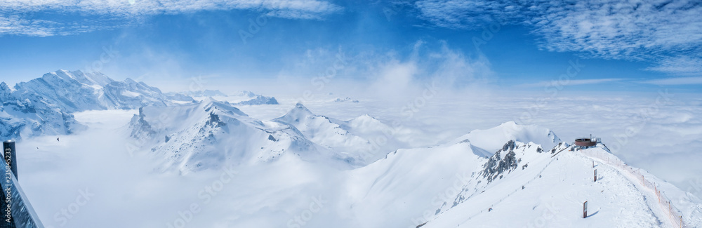 Stunning Panoramic view snow mountain of the Swiss Skyline from Schilthorn Piz Gloria, Switzerland