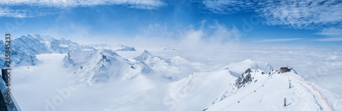 Stunning Panoramic view snow mountain of the Swiss Skyline from Schilthorn Piz Gloria, Switzerland © sahachat