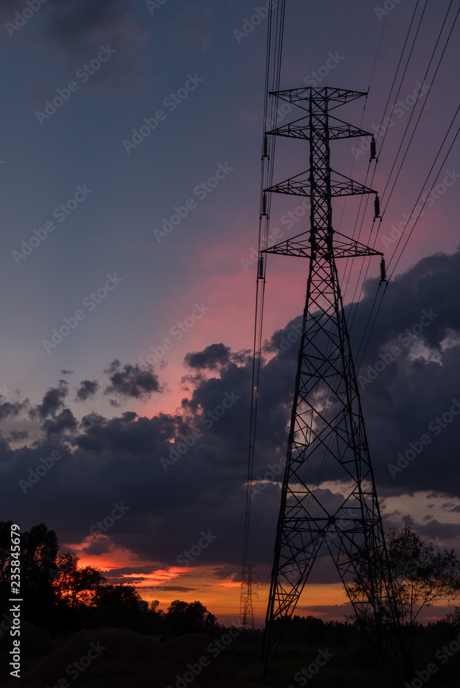Power line on a background dark lights sky and city landscape. Power line on a background dark lights sky and city landscape.