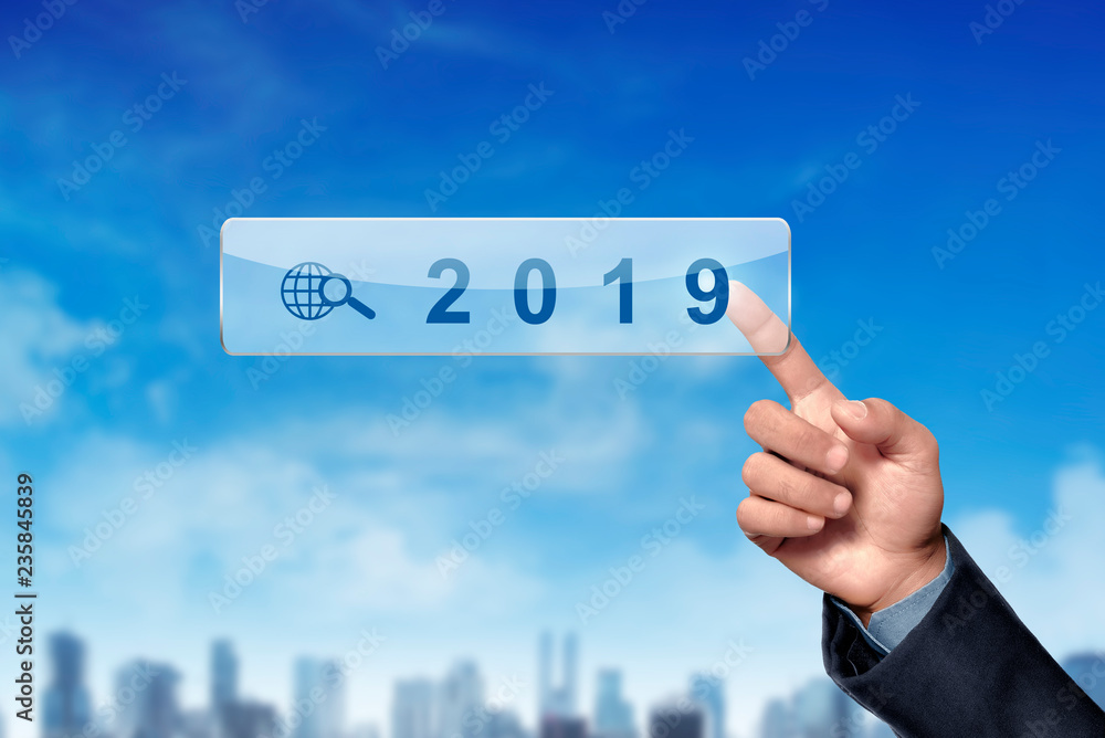 Businessman hands pointing 2019 on digital search bar Businessman hands pointing 2019 on digital search bar