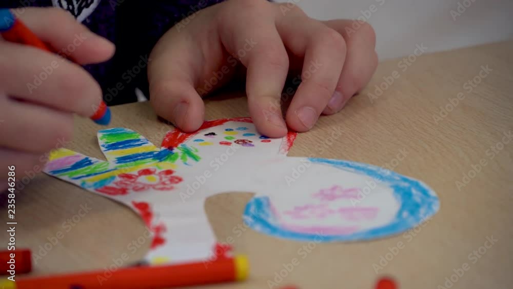 Children's hands are engaged in creativity. Painting at the Table Children's hands are engaged in creativity. Painting at the Table