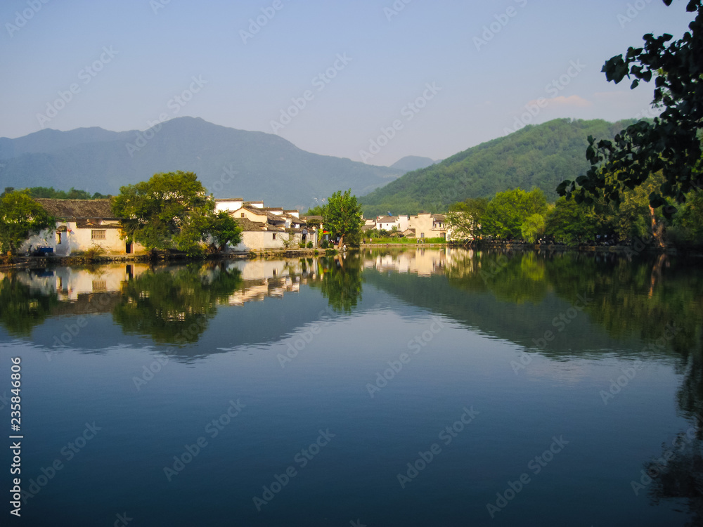 Unesco listed Hongcun old village with traditional Huizhou architecture in spring with clear blue sky.