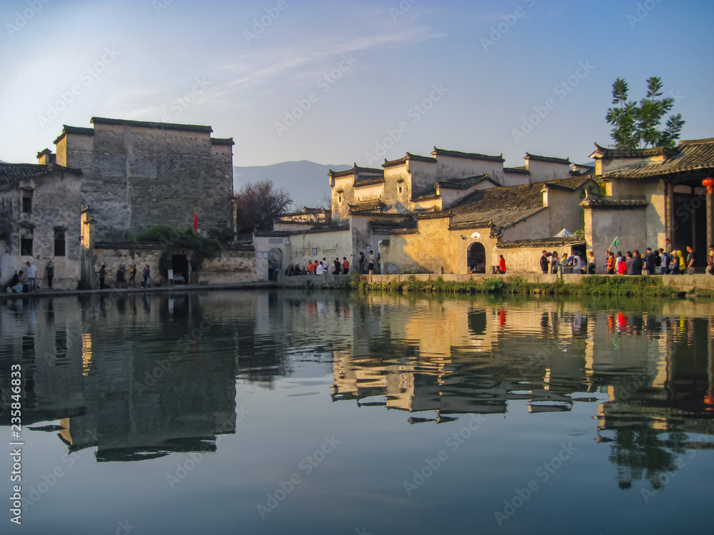 Houses in traditional Huizhou style next to the moon pond in Unesco listed Hongcun old village.