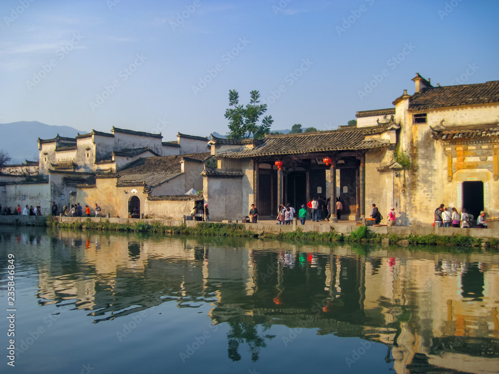 Houses in traditional Huizhou style next to the moon pond in Unesco listed Hongcun old village.