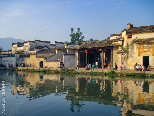 Houses in traditional Huizhou style next to the moon pond in Unesco listed Hongcun old village. photo