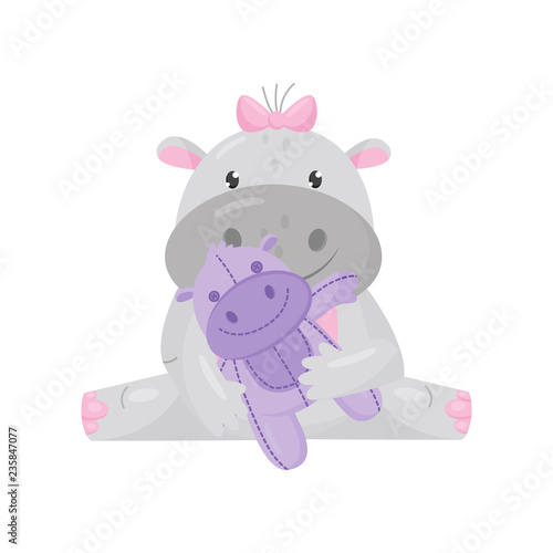 Cute adorable hippo with a pink bow sitting and playing with toy, lovely behemoth animal cartoon character vector Illustration
