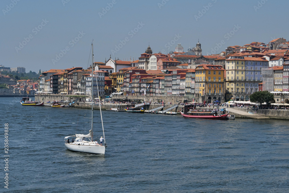 Duoro river Portugal with sailboat and Porto city behind