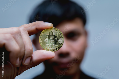 Bitcoin in hand of a businessman