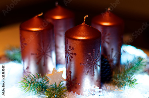 Advent wreath in red gold candles with snow as background and not yet lit candles © DatenschutzStockfoto