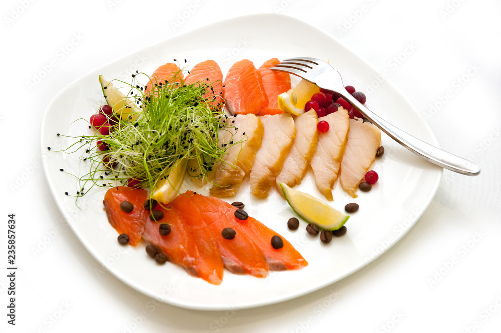 Dish with sliced red fish with citrus coffee beans and berries Dish with sliced red fish with citrus coffee beans and berries