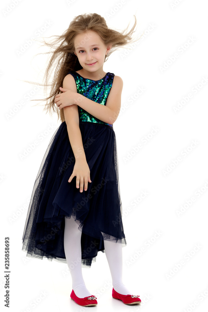 Little girl in a dress developing in the wind. Little girl in a dress developing in the wind.