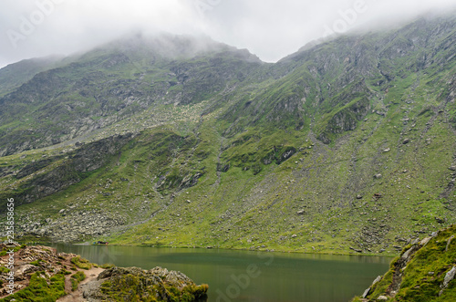 The glacier lake called Balea (Balea Lac) on the Transfagarasan road from Fagaras mountains photo