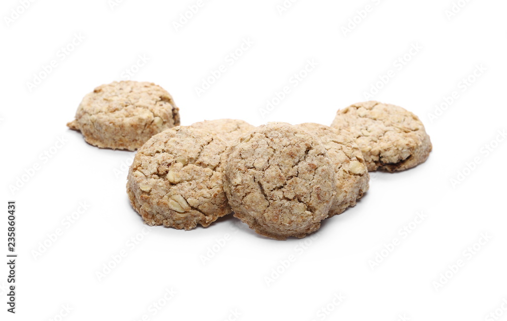 Integral round oatmeal cookies with raisins isolated on white background Integral round oatmeal cookies with raisins isolated on white background
