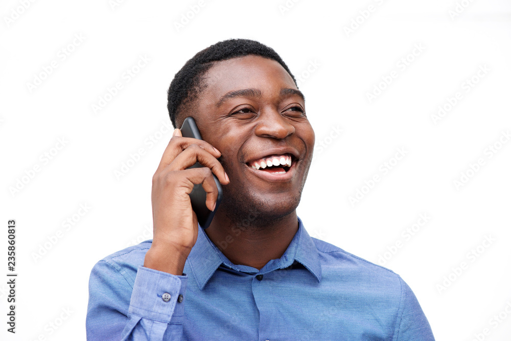 Close up african american businessman talking on mobile phone by isolated white background Close up african american businessman talking on mobile phone by isolated white background