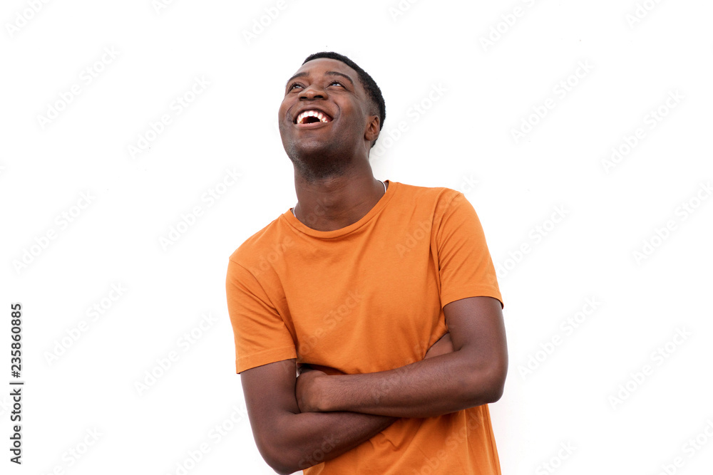happy young black man laughing and looking up happy young black man laughing and looking up