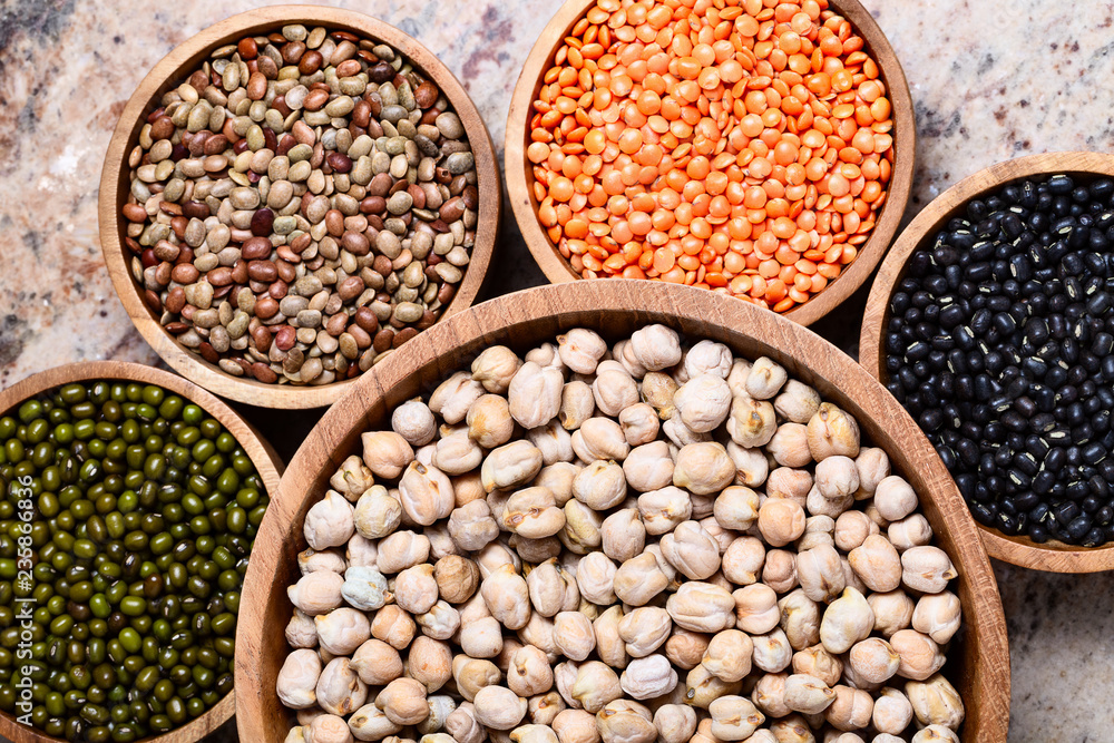 Various assortment of legumes - beans, chickpeas, lentils, black  and green orid dal. Vegetable proteins.