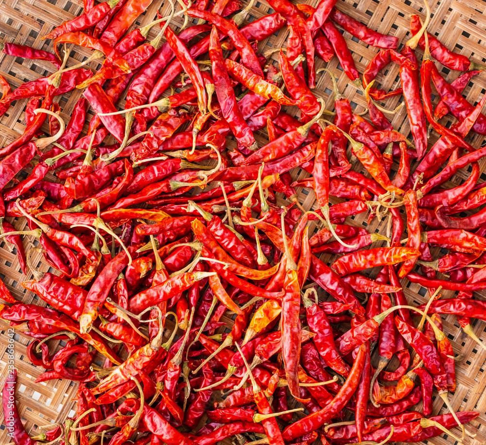 Dried red hot chilli pepper closeup background