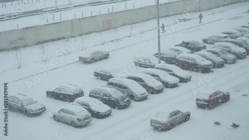 GOMEL, BELARUS - NOVEMBER 25, 2018: Snowfall on a parking in the city.