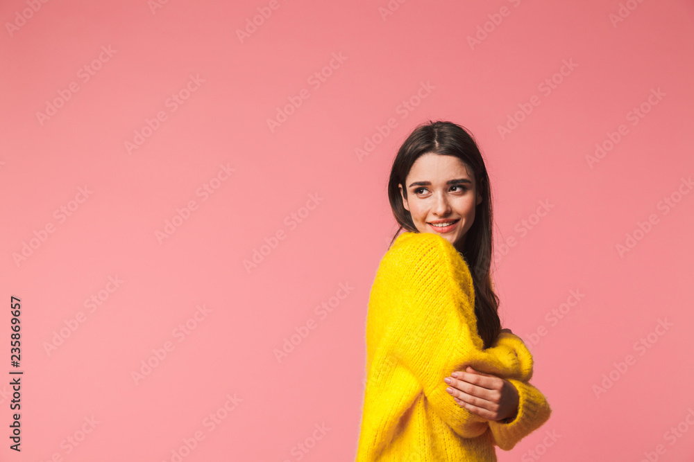 Beautiful happy young emotional woman posing isolated over pink background. Beautiful happy young emotional woman posing isolated over pink background.