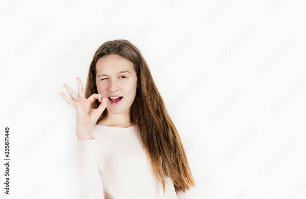 Bright beautiful girl emotionally posing on an isolated background. Bright beautiful girl emotionally posing on an isolated background.