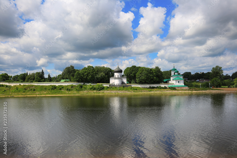 Pskov, Russia, June 22, 2016. Traveling through Russia, a beautiful summer view of the Great river and Transfigurtion Mirozhskiy Monastery