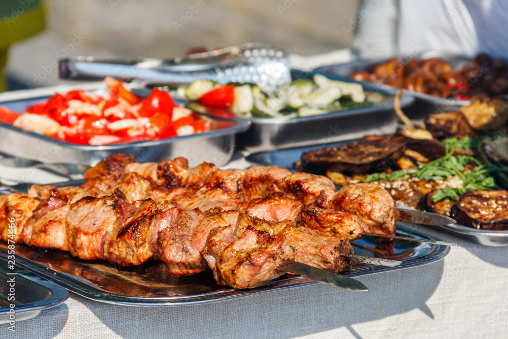 Shish kebab and other street food on a table