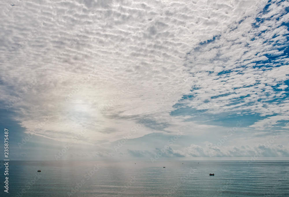 Fototapeta premium fishing boats far into the sea under the sky