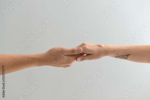 Man and woman holding hands...