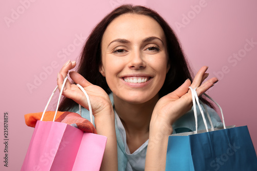 Happy girl with shopping ba...