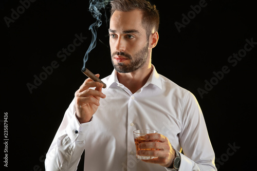 Businessman with glass of w...