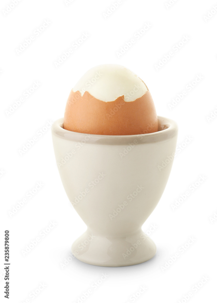Boiled chicken egg in holder on white background Boiled chicken egg in holder on white background