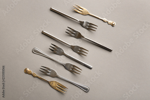 Set of forks on grey background