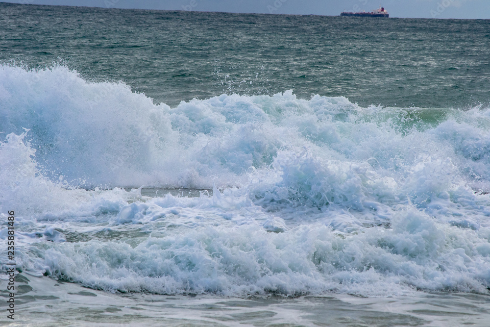 Landscape of a beach in north perth in a windy day full of waves water