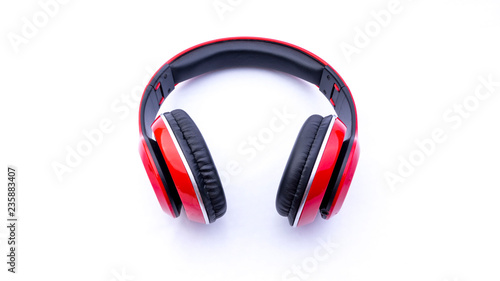 Wireless headphones closeup on white background with selective focus and crop fragme