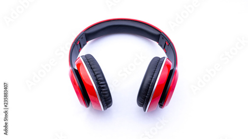 Wireless headphones closeup on white background with selective focus and crop fragme photo