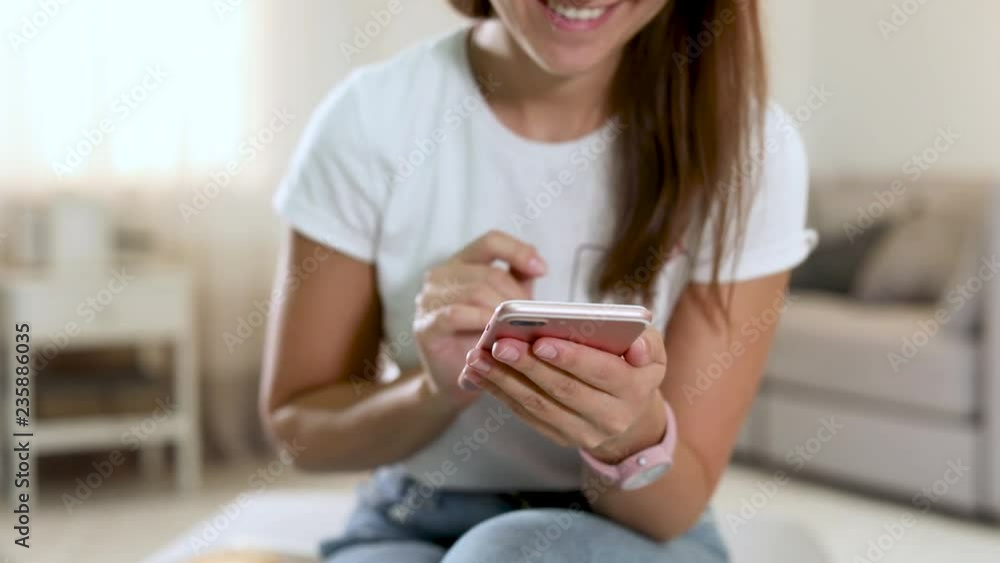 MYKOLAIV, UKRAINE - OCTOBER 17, 2018: Woman using Iphone at home, closeup