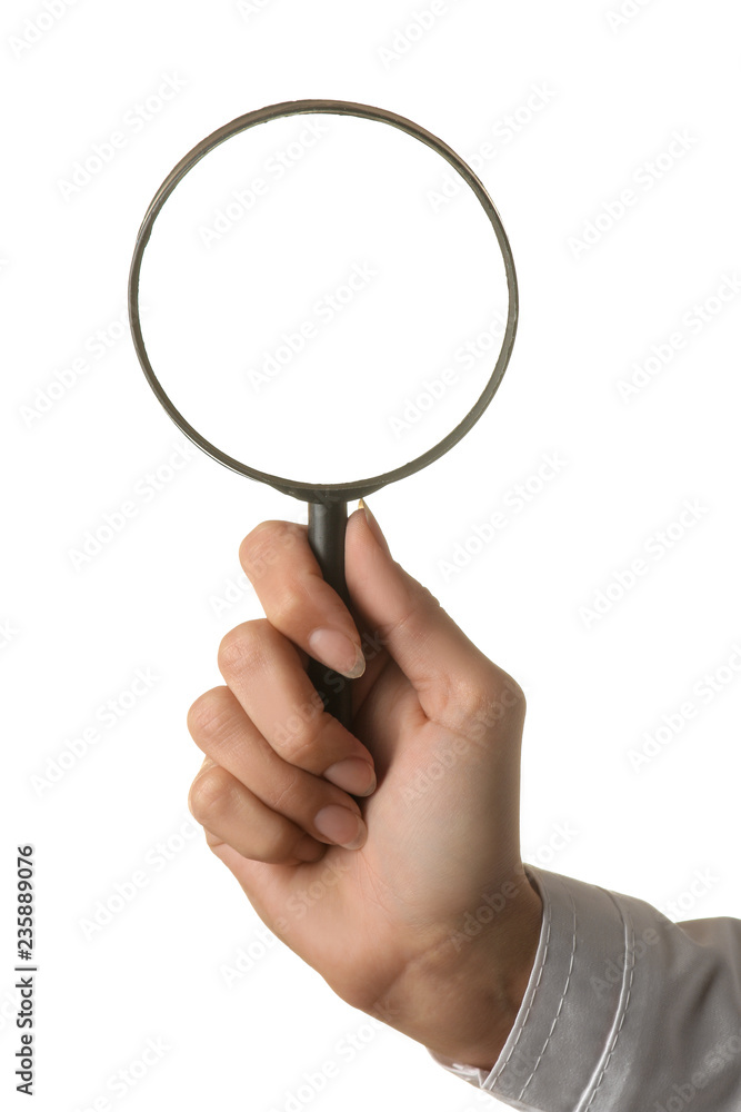 Woman doctor's hand is holding a magnifying glass on a white isolated background. hand gestures Woman doctor's hand is holding a magnifying glass on a white isolated background. hand gestures