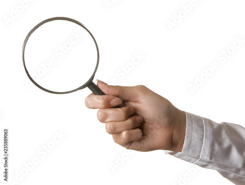 Woman doctor's hand is holding a magnifying glass on a white isolated background. hand gestures