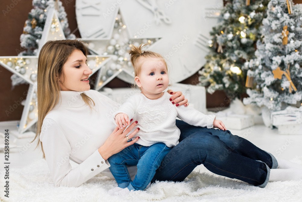 Mother with her baby girl on Christmas and New year holidays Mother with her baby girl on Christmas and New year holidays