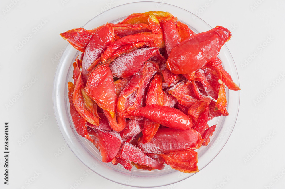 Frozen red bell pepper on white background