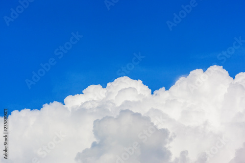 Sky background with the fluffy white clouds
